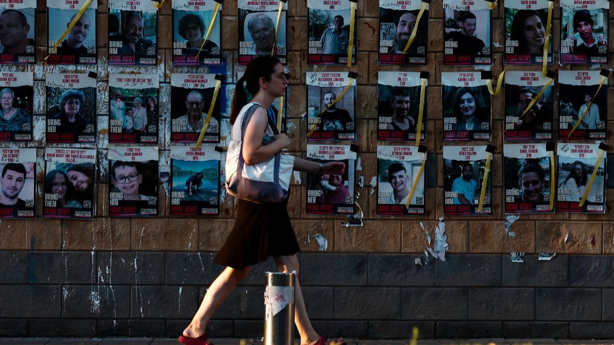 A woman walks past near images of those taken hostage or killed during the deadly October 7 attack, amid the ongoing conflict in Gaza between Israel and Hamas in Tel Aviv, Israel October 3, 2024. Reuters A woman walks past near images of those taken hostage or killed during the deadly October 7 attack, amid the ongoing conflict in Gaza between Israel and Hamas in Tel Aviv, Israel October 3, 2024. Reuters