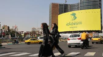 People walk past a billboard with a picture of the late Lebanon's Hezbollah leader Hassan Nasrallah, in a street in Tehran, Iran October 2, 2024. Reuters 