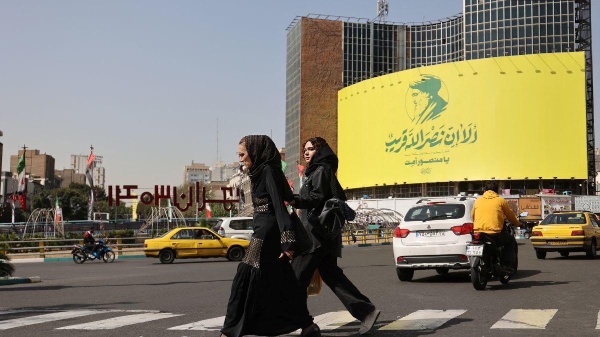People walk past a billboard with a picture of the late Lebanon's Hezbollah leader Hassan Nasrallah, in a street in Tehran, Iran October 2, 2024. Reuters People walk past a billboard with a picture of the late Lebanon's Hezbollah leader Hassan Nasrallah, in a street in Tehran, Iran October 2, 2024. Reuters