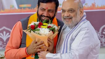Union Minister Amit Shah greets Nayab Singh Saini after he was unanimously elected as BJP's legislature party leader in Haryana, in Panchkula. PTI