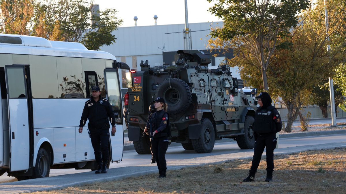 Turkish police officers gather as an armed personnel vehicle drives along a road in Kahramankazan. AFP Turkish police officers gather as an armed personnel vehicle drives along a road in Kahramankazan. AFP