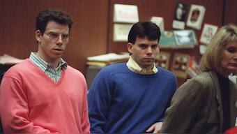 Erik Menendez (L) and his brother Lyle (R) listen during a pre-trial hearing, on December 29, 1992 in Los Angeles after the two pleaded innocent in the August 1989 shotgun deaths of their wealthy parents, Jose and Mary Louise Menendez of Beverly Hills, California. File Photo/AFP