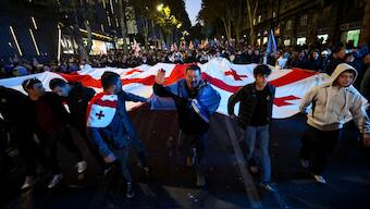 Supporters of the ruling Georgian Dream party attend the party's final campaign rally in Tbilisi on October 23, 2024, ahead of October 26 parliamentary elections. AFP files