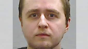 This undated handout custody photograph released by Police Service of Northern Ireland (PSNI) on October 25, 2024, shows Alexander McCartney, considered UK's worst catfishing offender. AFP