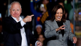 Democratic presidential nominee US Vice President Kamala Harris and Democractic Vice-Presidential candidate Tim Walz gesture from the stage during a campaign rally in Ann Arbor, Michigan, US October 28, 2024. Reuters