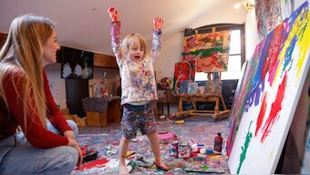 Laurent Schwarz reacts next to his mother Lisa while creating an artwork in his studio in his parents' house in Neubeuern near Rosenheim, southern Germany on October 17, 2024. AFP
