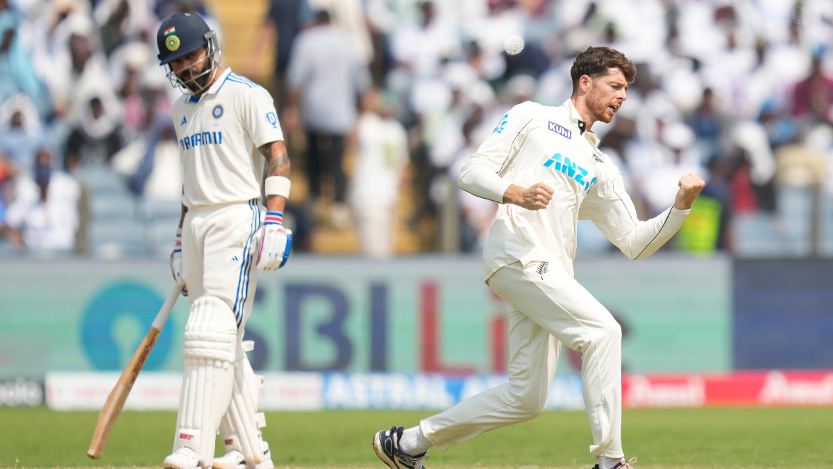 New Zealand left-arm spinner Mitchell Santner celebrates after dismissing India's Virat Kohli on Day 3 of the second Test in Pune. AP New Zealand left-arm spinner Mitchell Santner celebrates after dismissing India's Virat Kohli on Day 3 of the second Test in Pune. AP