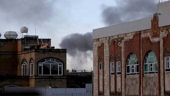 Smoke billows in Sanaa following explosions, on Friday. Strikes by the United States targeted three rebel-run cities in Yemen, including the capital Sanaa and the port city of Hodeida, according to the Houthi-run Al Masirah television network. AFP