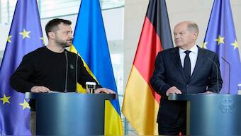 Ukraine's President Volodymyr Zelenskyy watches German chancellor Olaf Scholz during a statement at the chancellery in Berlin, Germany, on Friday. AP 