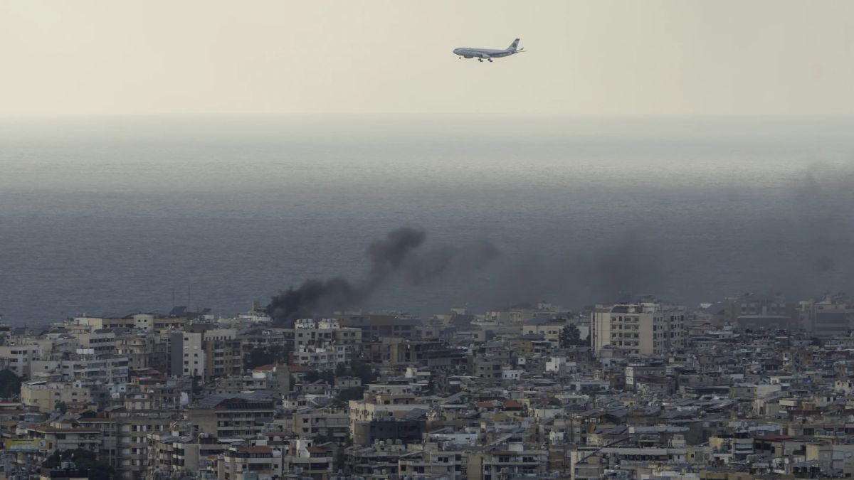 A Middle East Airlines airplane flies over Beirut as smoke from ISraeli airstrikes in Dahiyeh, Beirut. AP A Middle East Airlines airplane flies over Beirut as smoke from ISraeli airstrikes in Dahiyeh, Beirut. AP