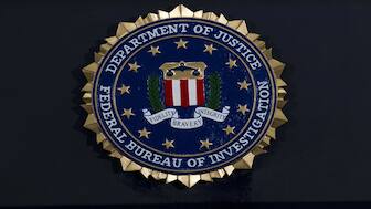 FBI seal at a news conference at FBI headquarters in Washington. File Image: AP