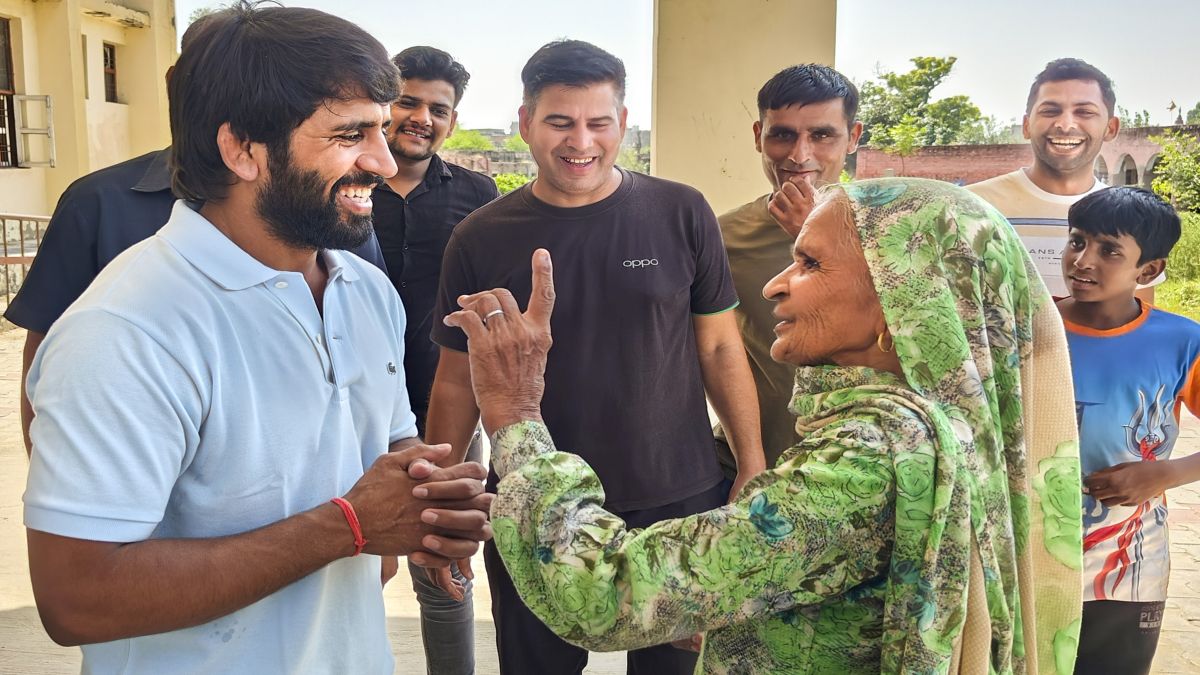 Wrestler Bajrang Punia interacts with people as he arrives to cast his vote during Haryana Assembly elections, at Khuddan in Jhajjar. File image/PTI Wrestler Bajrang Punia interacts with people as he arrives to cast his vote during Haryana Assembly elections, at Khuddan in Jhajjar. File image/PTI