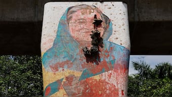 A view shows a mural of Bangladeshi Prime Minister Sheikh Hasina vandalised by protesters after her resignation, in Dhaka, Bangladesh. Many believe that the interim government could soon ban her party, the Awami League, from political activities. File image/Reuters