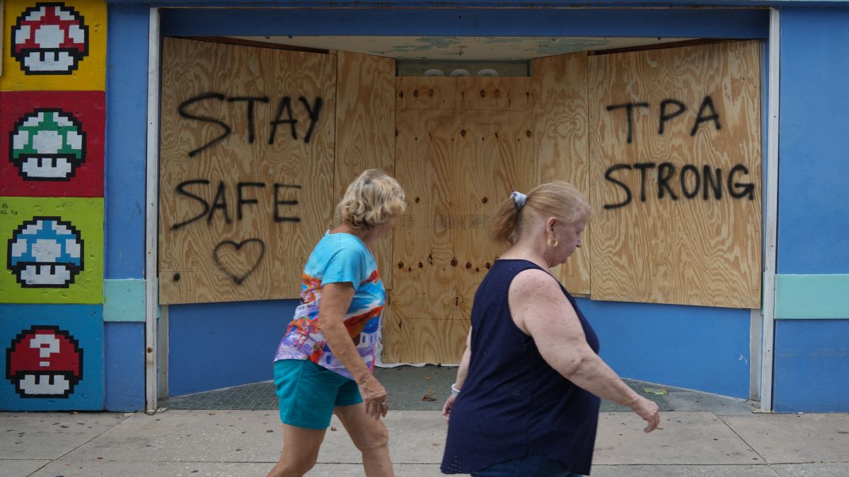 People walk past boarded up storefronts in Tampa ahead of Hurricane Milton's expected landfall in Florida. Hurricane Milton exploded in strength to become a potentially catastrophic Category 5 storm bound for Florida, threatening the US state with a second ferocious hurricane in as many weeks. AFP People walk past boarded up storefronts in Tampa ahead of Hurricane Milton's expected landfall in Florida. Hurricane Milton exploded in strength to become a potentially catastrophic Category 5 storm bound for Florida, threatening the US state with a second ferocious hurricane in as many weeks. AFP