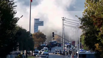 Smoke raises as emergency rescue teams and police officers attend outside Turkish Aerospace Industries Inc. on the outskirts of Ankara, Turkey, Wednesday, Oct. 23, 2024. AP