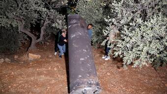 Palestinians investigate a projectile, after Iran fired a salvo of ballistic missiles, in Tubas, in West Bank, October 1. The Islamic Republic launched 180 missiles at Israel  in response to the killing of Hezbollah chief Hassan Nasrallah and others. Reuters