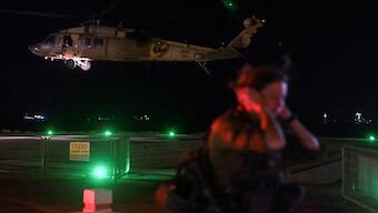 An Israeli soldier stands by as a military helicopter takes off after it dropped off patients that were injured in a drone attack from Lebanon, amid cross-border hostilities between Hezbollah and Israel, at Rambam Health Care Campus in Haifa, Israel, on October 13, 2024. Lebanon's Hezbollah claimed responsibility for the attack. Reuters