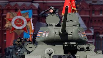 A Russian service member is seen atop a T-34 Soviet-era tank that drives along Red Square during a rehearsal for a military parade. Russia is to increase its spending on defence by 25 per cent to its highest on record. Representational image/Reuters