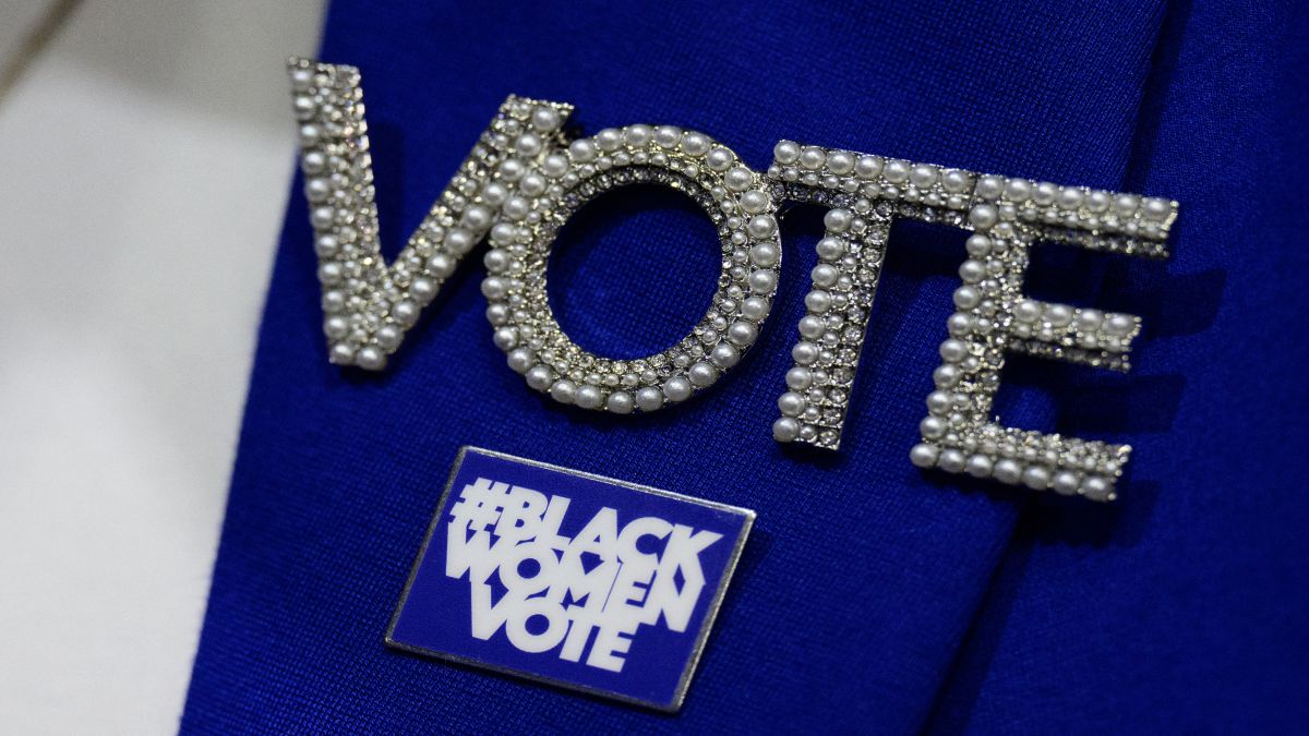 A woman wears a "Vote" pin to encourage people to cast their ballot in the November 5 US presidential elections. File image/AFP A woman wears a "Vote" pin to encourage people to cast their ballot in the November 5 US presidential elections. File image/AFP