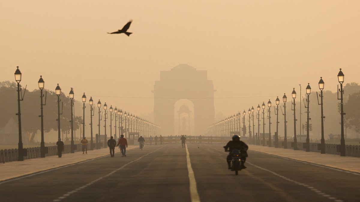 People walk on Kartavyapath near India Gate on a hazy morning in New Delhi, India, November 1, 2024. Reuters People walk on Kartavyapath near India Gate on a hazy morning in New Delhi, India, November 1, 2024. Reuters