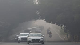 Traffic passes by on a road as the sky is enveloped with smog after Delhi's air quality was classified as "hazardous" amidst severe air pollution, in New Delhi, India, November 14, 2024. Reuters