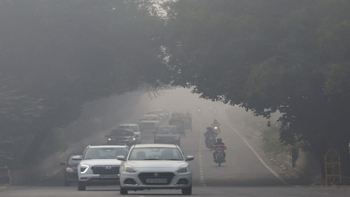 Traffic passes by on a road as the sky is enveloped with smog after Delhi's air quality was classified as "hazardous" amidst severe air pollution, in New Delhi, India, November 14, 2024. Reuters Traffic passes by on a road as the sky is enveloped with smog after Delhi's air quality was classified as "hazardous" amidst severe air pollution, in New Delhi, India, November 14, 2024. Reuters