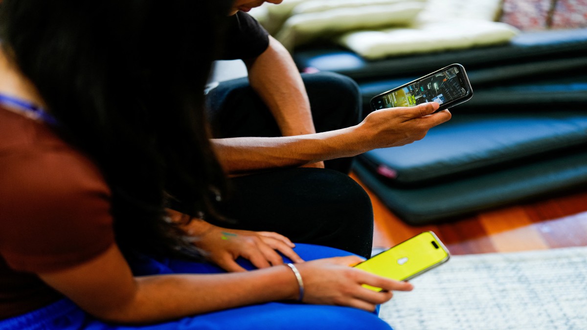Two school students pose with their mobile showing social media applications in Melbourne, Australia. Reuters Two school students pose with their mobile showing social media applications in Melbourne, Australia. Reuters