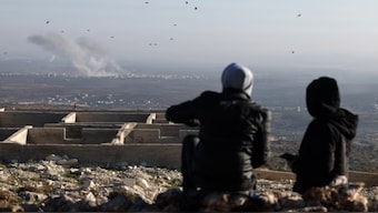 Smoke billows as opposition and government forces clash on the outskirts of the city of Saraqib, Aleppo province, just off the highway between Damascus and Aleppo. AFP
