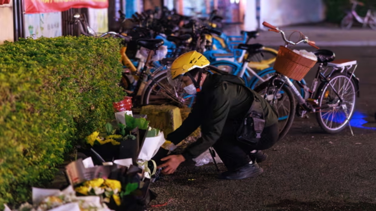 People place floral tributes outside a sports centre where a deadly car attack took place in Zhuhai. Reuters People place floral tributes outside a sports centre where a deadly car attack took place in Zhuhai. Reuters