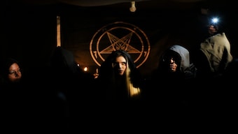 Siuling, center, a member of The Temple of Satan: Satanists and Luciferians of Chile, takes part in a Celtic pagan celebration, in Santiago, Thursday, October 31, 2024. AP