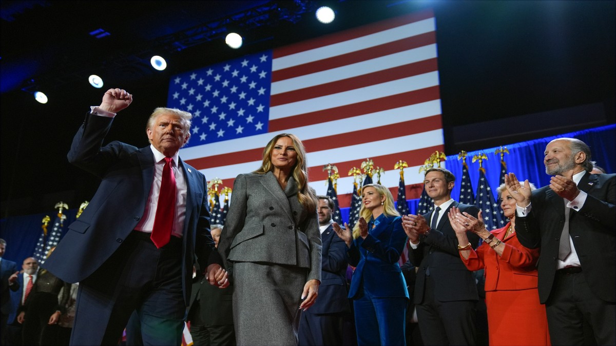 Republican presidential nominee former President Donald Trump gestures as he walks with former first lady Melania Trump at an election night watch party at the Palm Beach Convention Center, Wednesday, November 6, 2024, in West Palm Beach, Florida. AP Republican presidential nominee former President Donald Trump gestures as he walks with former first lady Melania Trump at an election night watch party at the Palm Beach Convention Center, Wednesday, November 6, 2024, in West Palm Beach, Florida. AP