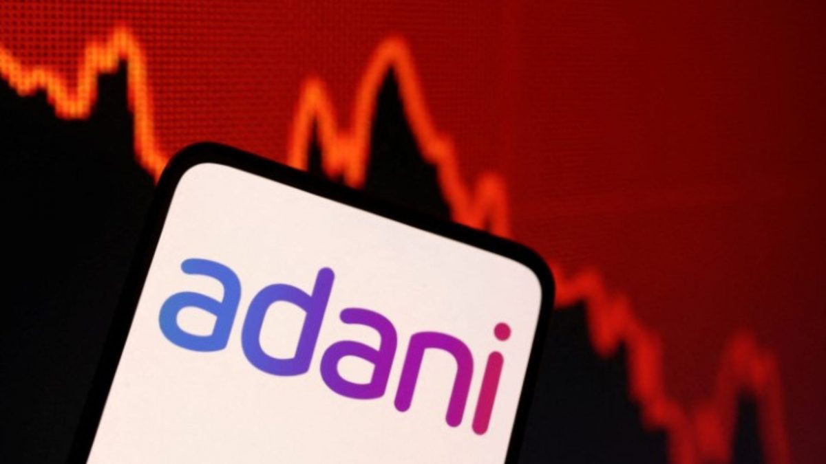 Illustration shows Adani logo and decreasing stock graph. Source: Reuters. Illustration shows Adani logo and decreasing stock graph. Source: Reuters.
