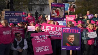 Pro legal assisted dying supporters demonstrate in front of Parliament in London, on Friday. AP 