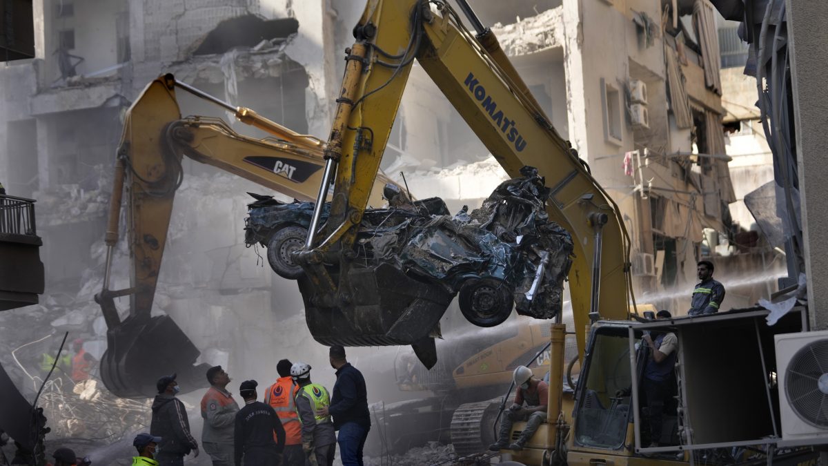 An excavator removes a destroyed car as rescue workers gather at the site of an Israeli airstrike that hit central Beirut, Lebanon. AP An excavator removes a destroyed car as rescue workers gather at the site of an Israeli airstrike that hit central Beirut, Lebanon. AP
