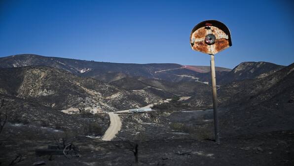 California blaze claims over 130 homes as firefighters gain ground