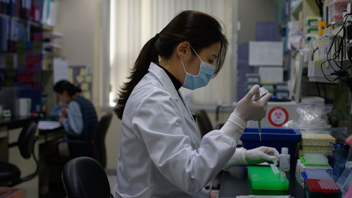 A lab technician working in Seoul, South Korea. (Representative Photo, Credit: AFP) A lab technician working in Seoul, South Korea. (Representative Photo, Credit: AFP)