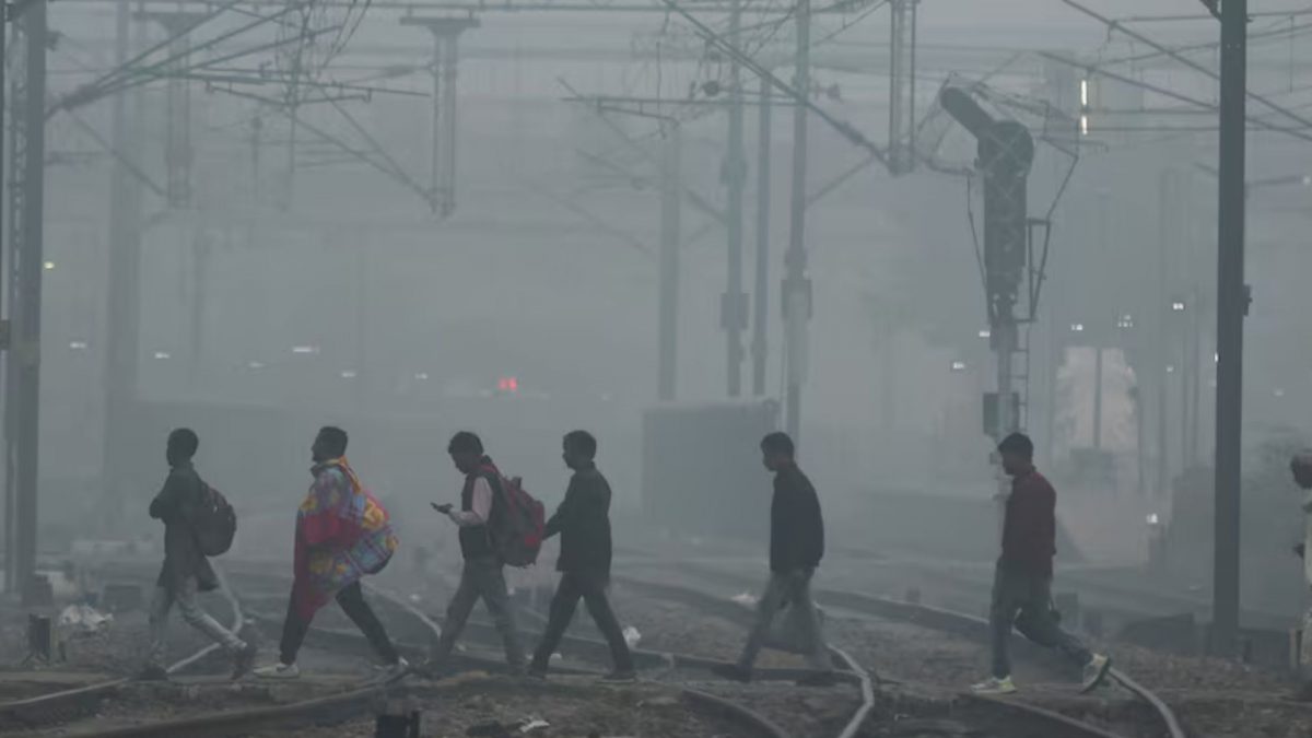 People cross railway tracks on a smoggy morning in New Delhi. Source: REUTERS | FILE. People cross railway tracks on a smoggy morning in New Delhi. Source: REUTERS | FILE.
