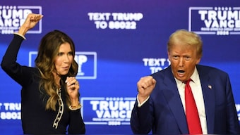 Donald Trump and South Dakota governor Kristi Noem dance during a town hall campaign event in Oaks, Pennsylvania. Source:  Reuters