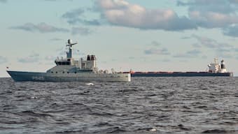 The Chinese ship, the bulk carrier Yi Peng 3, in background, is anchored and being monitored by a Danish naval patrol vessels in the sea of Kattegat, near the city of Granaa in Jutland, Denmark, Wednesday, Nov. 20, 2024. (Photo: AP)