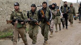 Syrian opposition forces' personnel walk carrying their weapons on the outskirts of the northern Syrian town of Al-Bab, Syria, January 15, 2017. (Photo: Reuters)