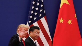US President Donald Trump waves next to Chinese President Xi Jinping after attending a business event at the Great Hall of the People in Beijing on November 9, 2017, during his first term. (Photo: AP)