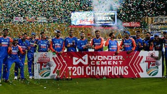 The Indian players celebrate with the trophy after completing a 3-1 T20I series victory over South Africa with a 135-run victory in Johannesburg on Friday. AP