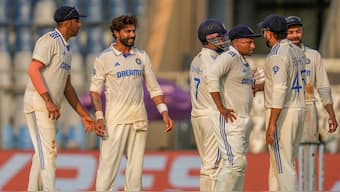 Ravindra Jadeja celebrates with teammates after dismissing Ish Sodhi on Day 2 of the third Test between India and New Zealand in Mumbai. AP