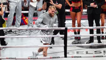 Jake Paul's silver outfit for his highly-anticipated bout against Mike Tyson consisted of 380 carats of diamonds along with a custom piece painted by street artist Alec Monopoly. Reuters