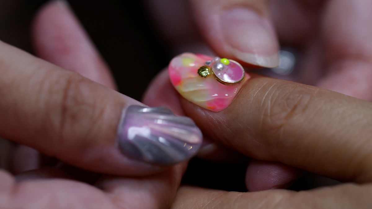 Japanese manicurist Naomi Arimoto presses a false nail with a decorative nail tip using plastic waste, which she collected from the beach onto a thumb of a customer at her nail salon in Chigasaki, Kanagawa Prefecture, Japan. Reuters Japanese manicurist Naomi Arimoto presses a false nail with a decorative nail tip using plastic waste, which she collected from the beach onto a thumb of a customer at her nail salon in Chigasaki, Kanagawa Prefecture, Japan. Reuters