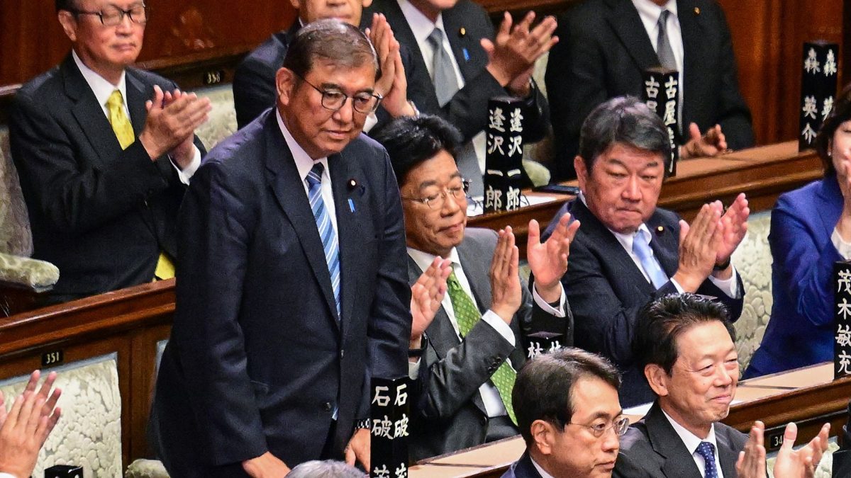Lawmakers applaud as Japan's Prime Minister Shigeru Ishiba (standing Left) is reappointed as leader after the second round of a parliamentary vote to nominate a prime minister following the October 27 general election, during a special session of parliament in Tokyo on November 11, 2024. Source: AFP. Lawmakers applaud as Japan's Prime Minister Shigeru Ishiba (standing Left) is reappointed as leader after the second round of a parliamentary vote to nominate a prime minister following the October 27 general election, during a special session of parliament in Tokyo on November 11, 2024. Source: AFP.