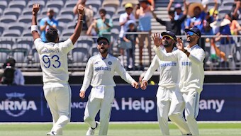 India captain Jasprit Bumrah celebrates with teammates after getting rid of Australia wicketkeeper-batter Alex Carey on Day 2 of the first Test in Perth. AP