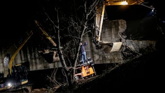 Workers work near the damaged canal in northern Kosovo supplying water to two coal-fired power plants that generate nearly all of the country's electricity, in Varage, Kosovo. Reuters