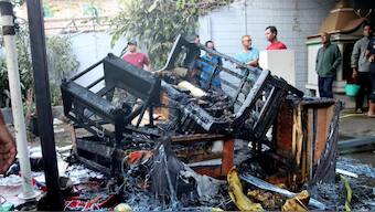 Charred remains of goods after demonstrations following bodies, suspected to be of six missing people from Jiribam district, were found near the Manipur-Assam border on Friday night. Source: PTI.