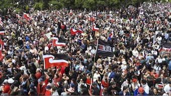 Protesters opposing  a proposed law that would redefine New Zealand's founding treaty between the British Crown and Maori chiefs gather outside Parliament in Wellington, New Zealand. AP